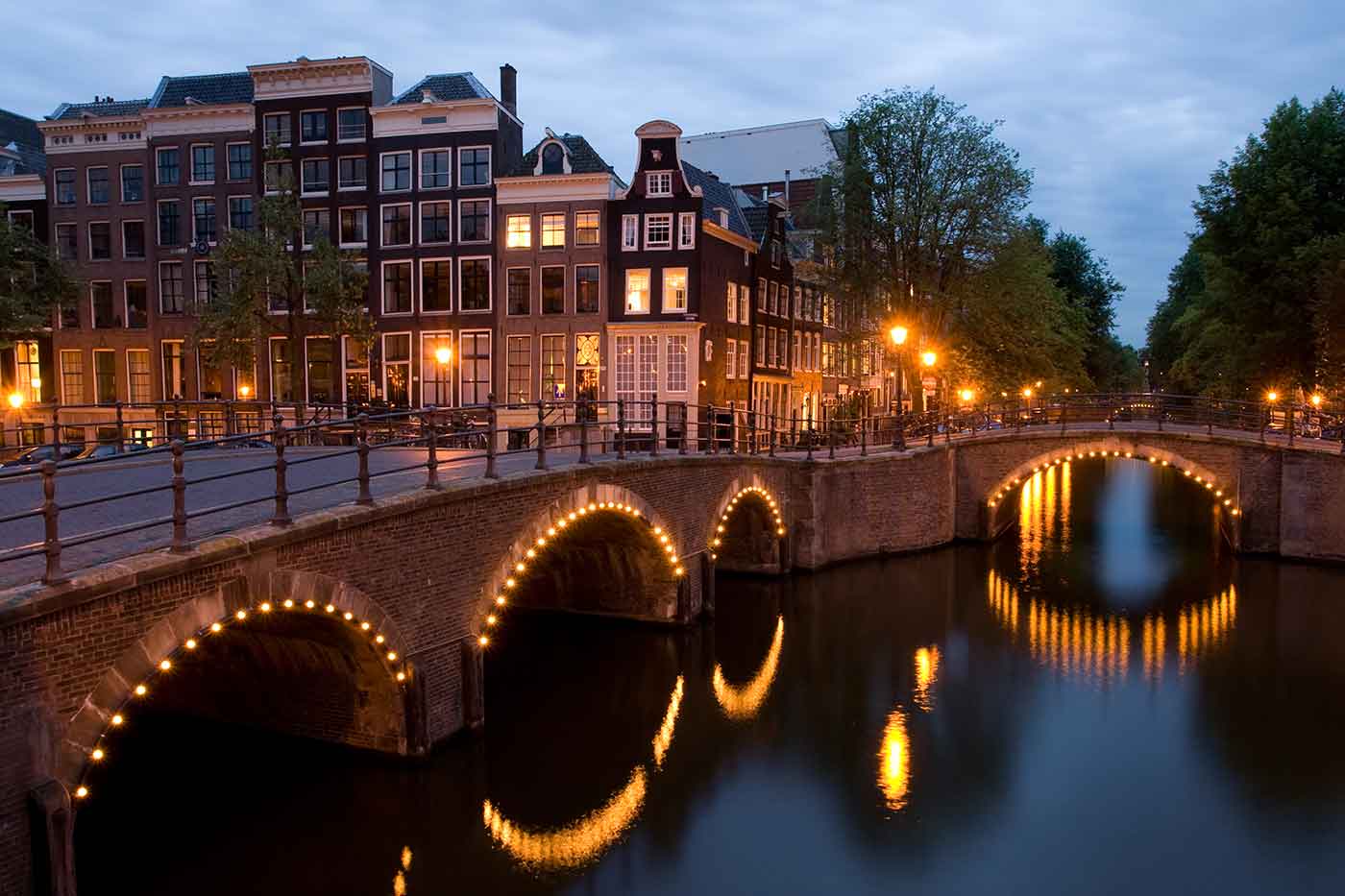 A view of the Reguliersgracht on the corner with the Keizersgracht, in Amsterdam, the Netherlands at dusk.