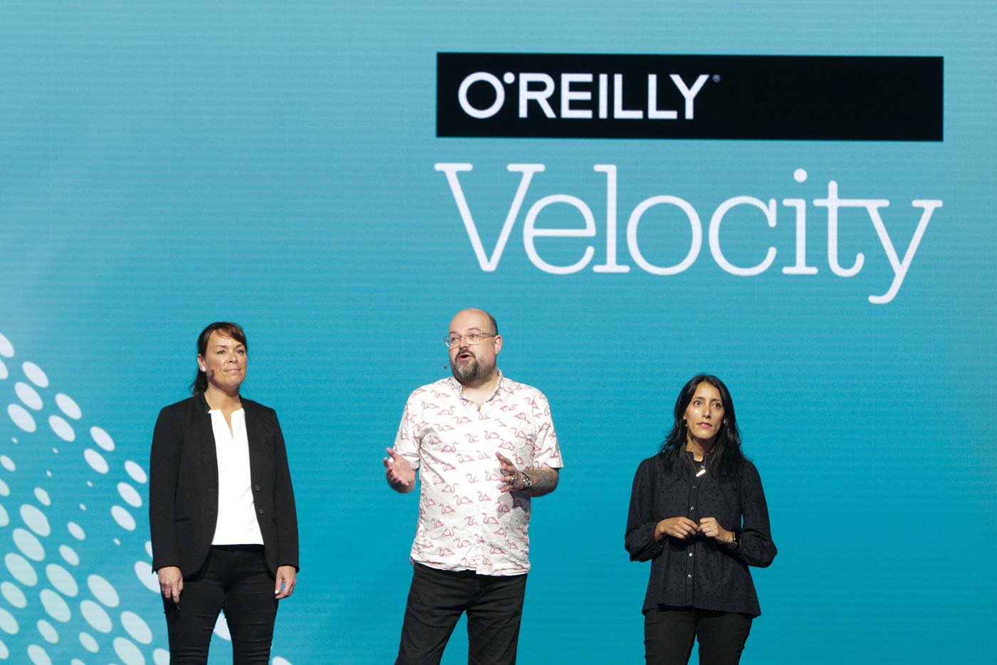 L to R: Velocity chairs Mary Treseler, James Turnbull, and Ines Sombra at the O'Reilly Velocity Conference in San Jose 2017.